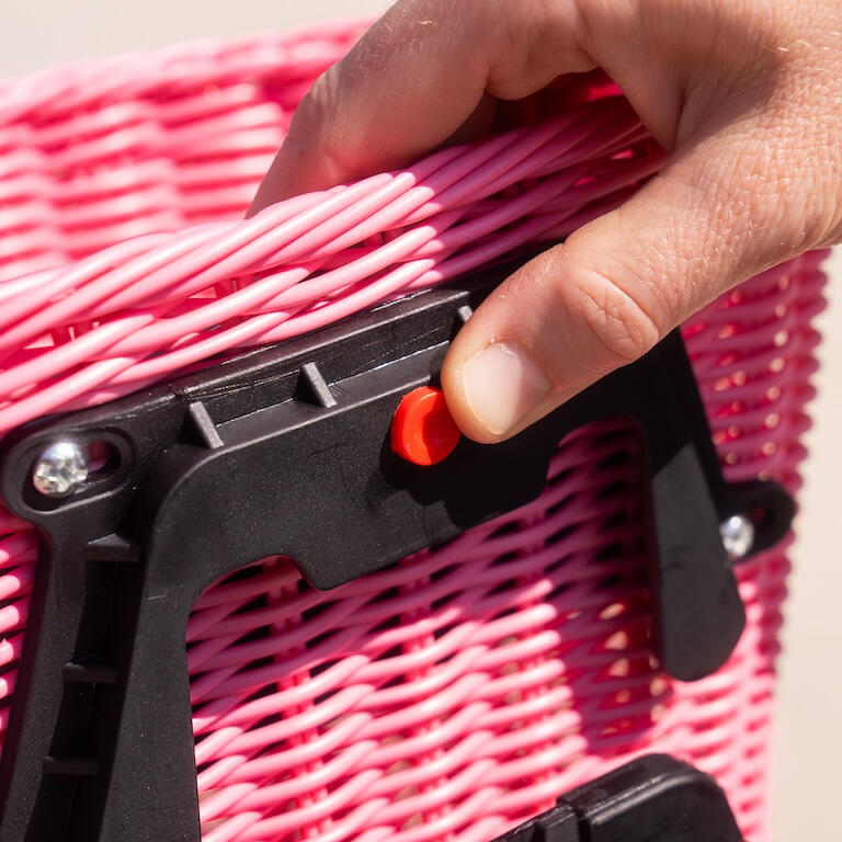 Push the red button to remove the detachable Pedalon bike basket for kids.